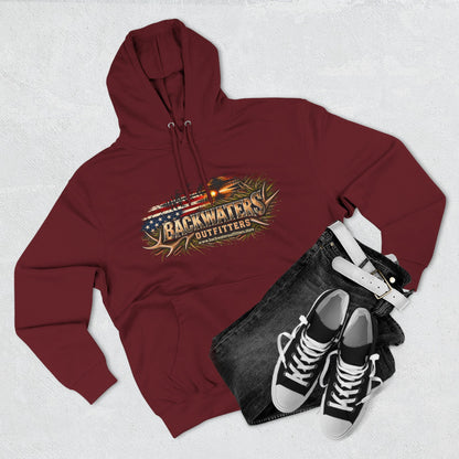 Maroon hoodie with graphic design, black jeans, and black sneakers on a light gray background
